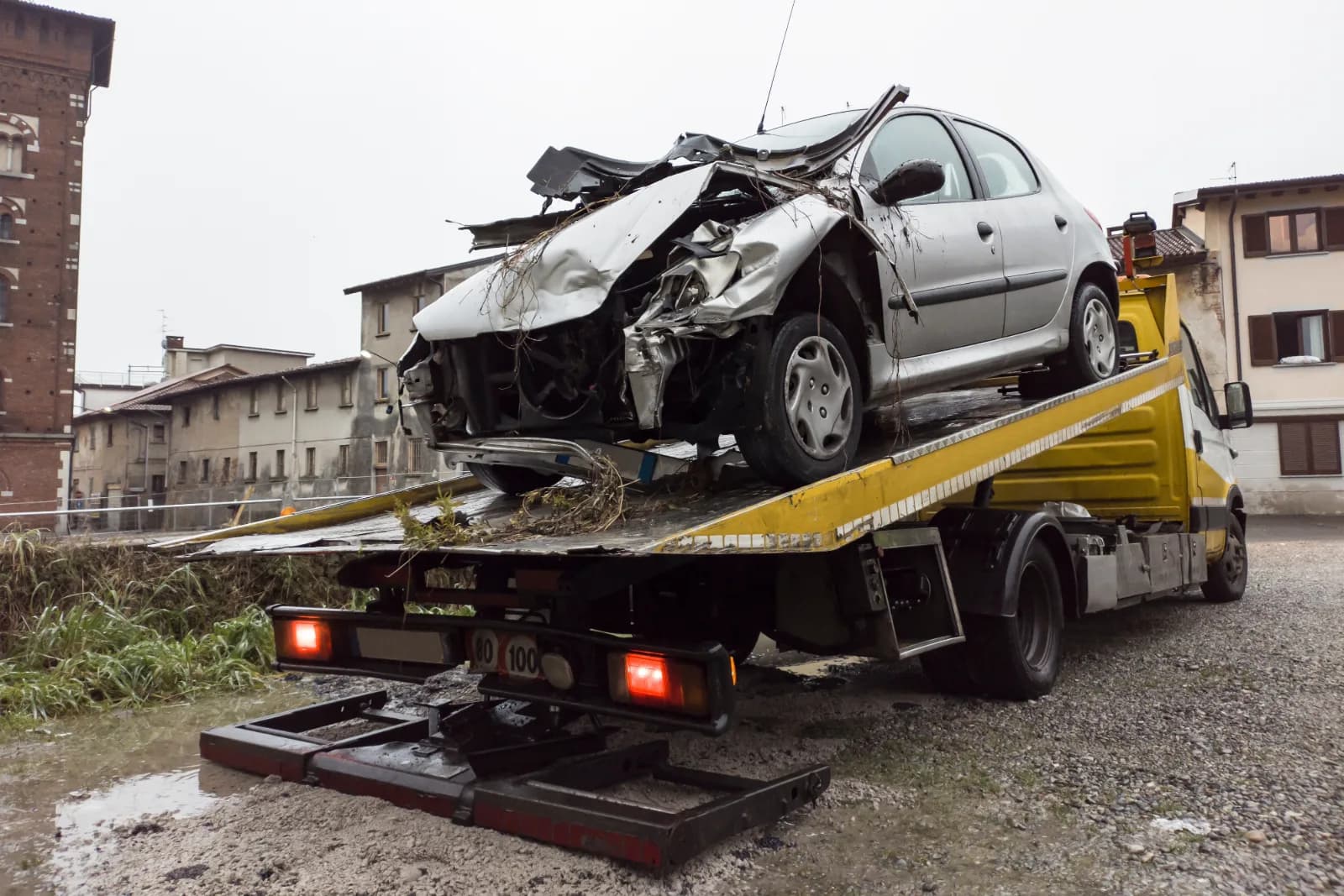 A vehicle being loaded for transport.